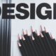 Black pencils and Design word